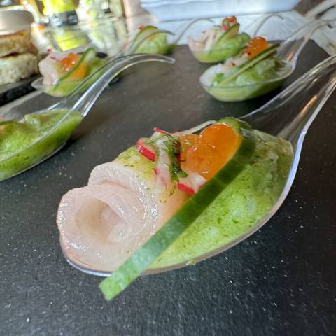 Crudo served on spoons with cucumber